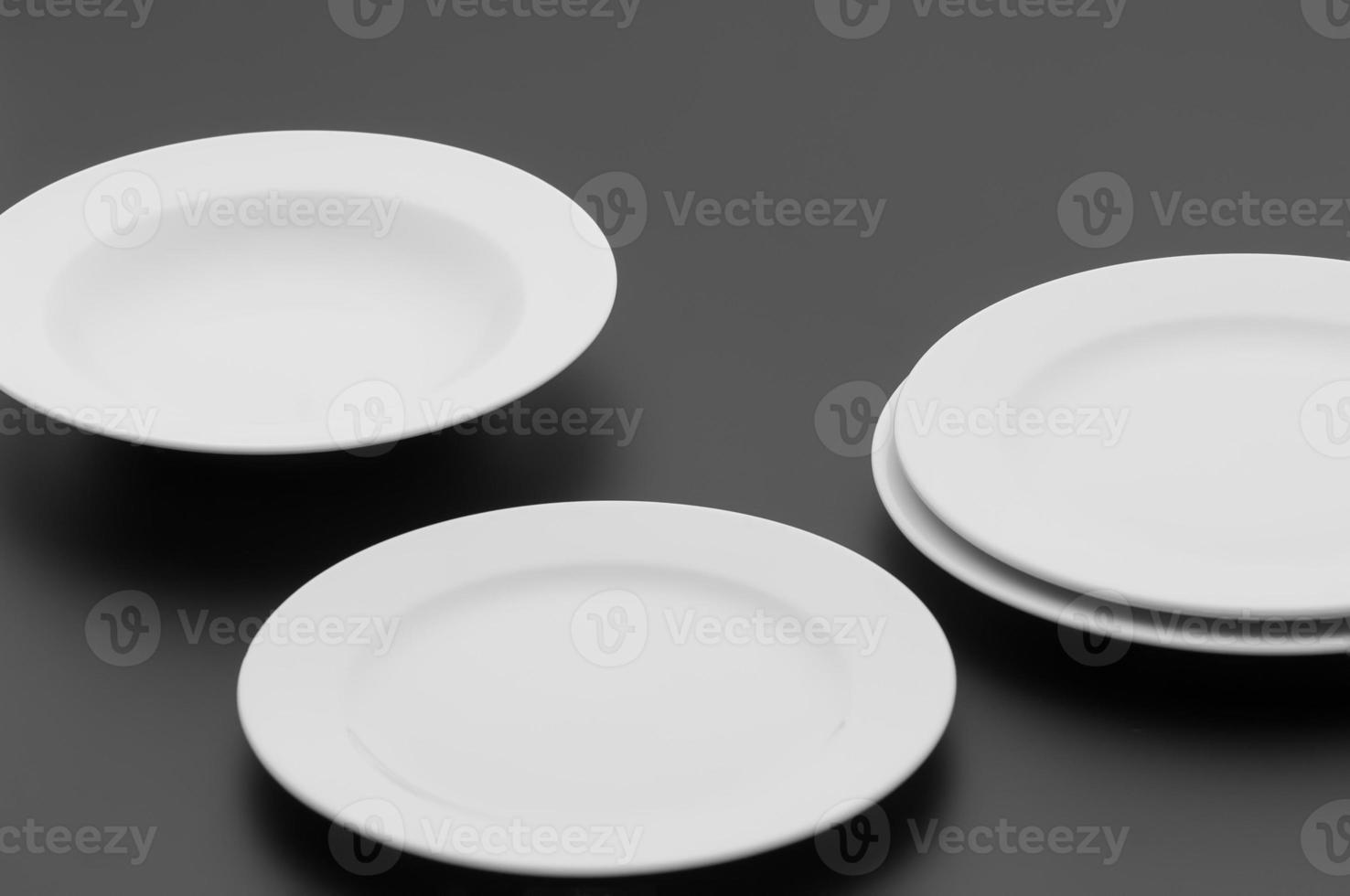 kitchen and restaurant utensils, plates, on a dark background photo