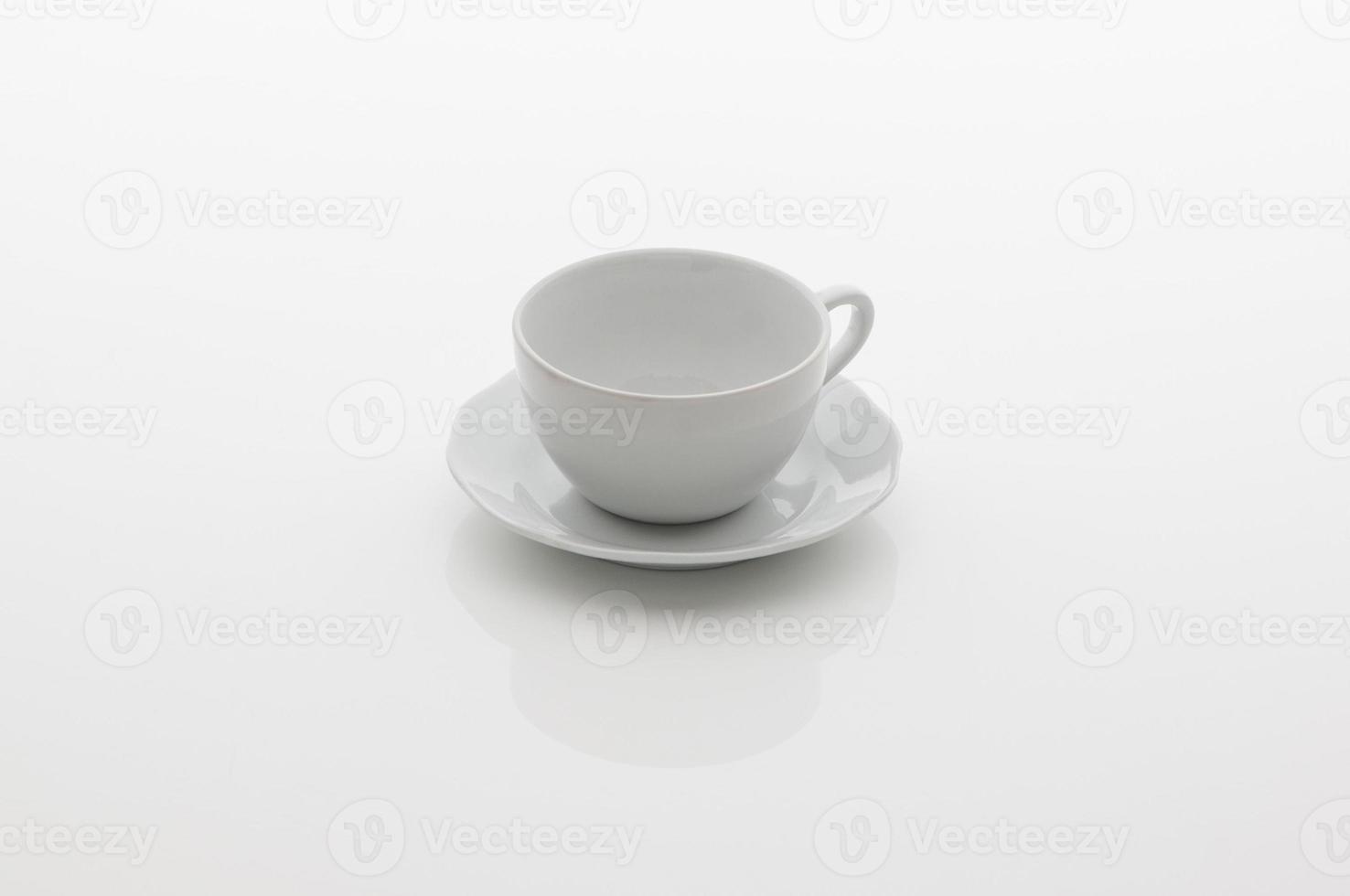 ceramic kitchen cup for tea and saucer on white background photo