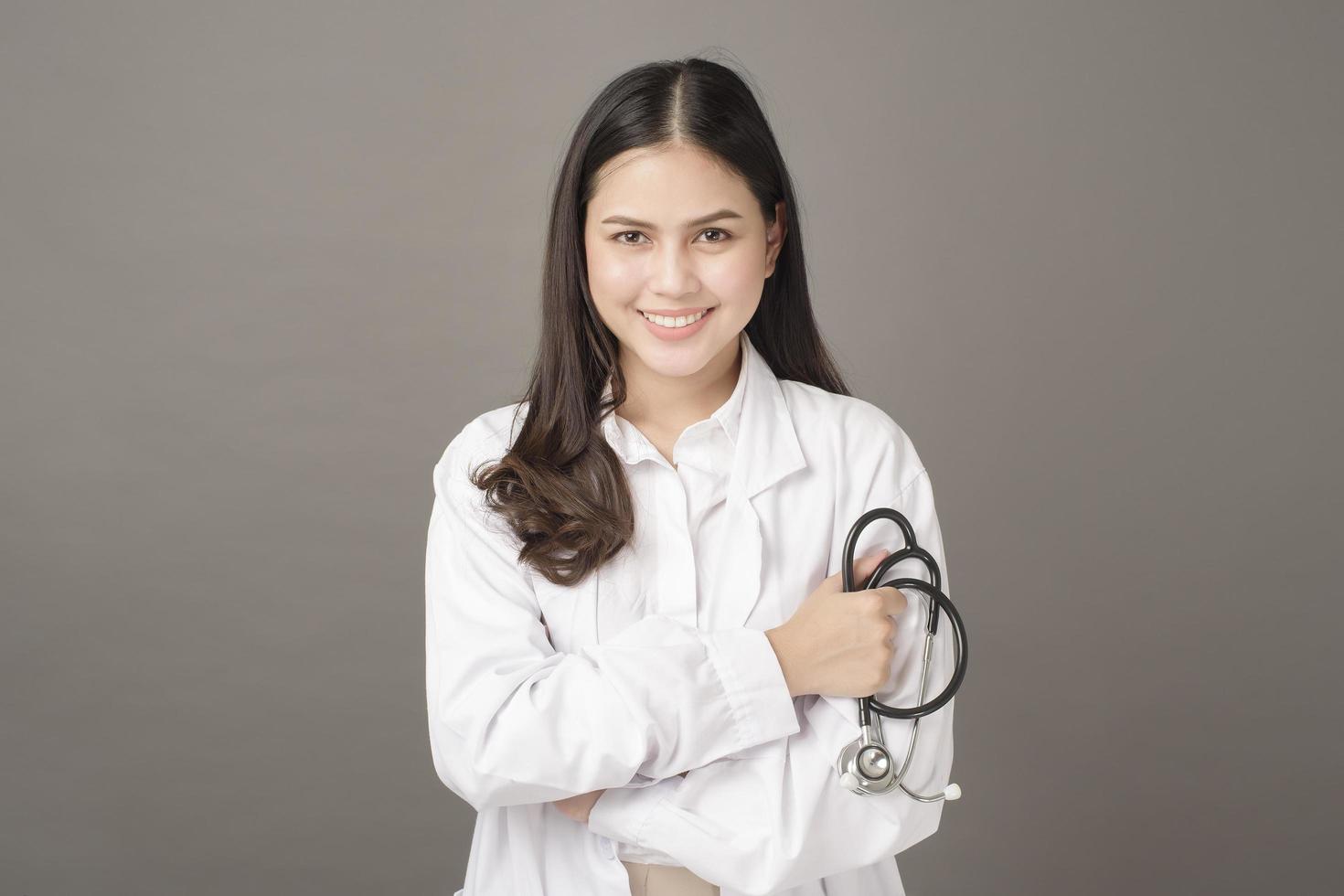 Smart woman doctor is holding stethoscope photo