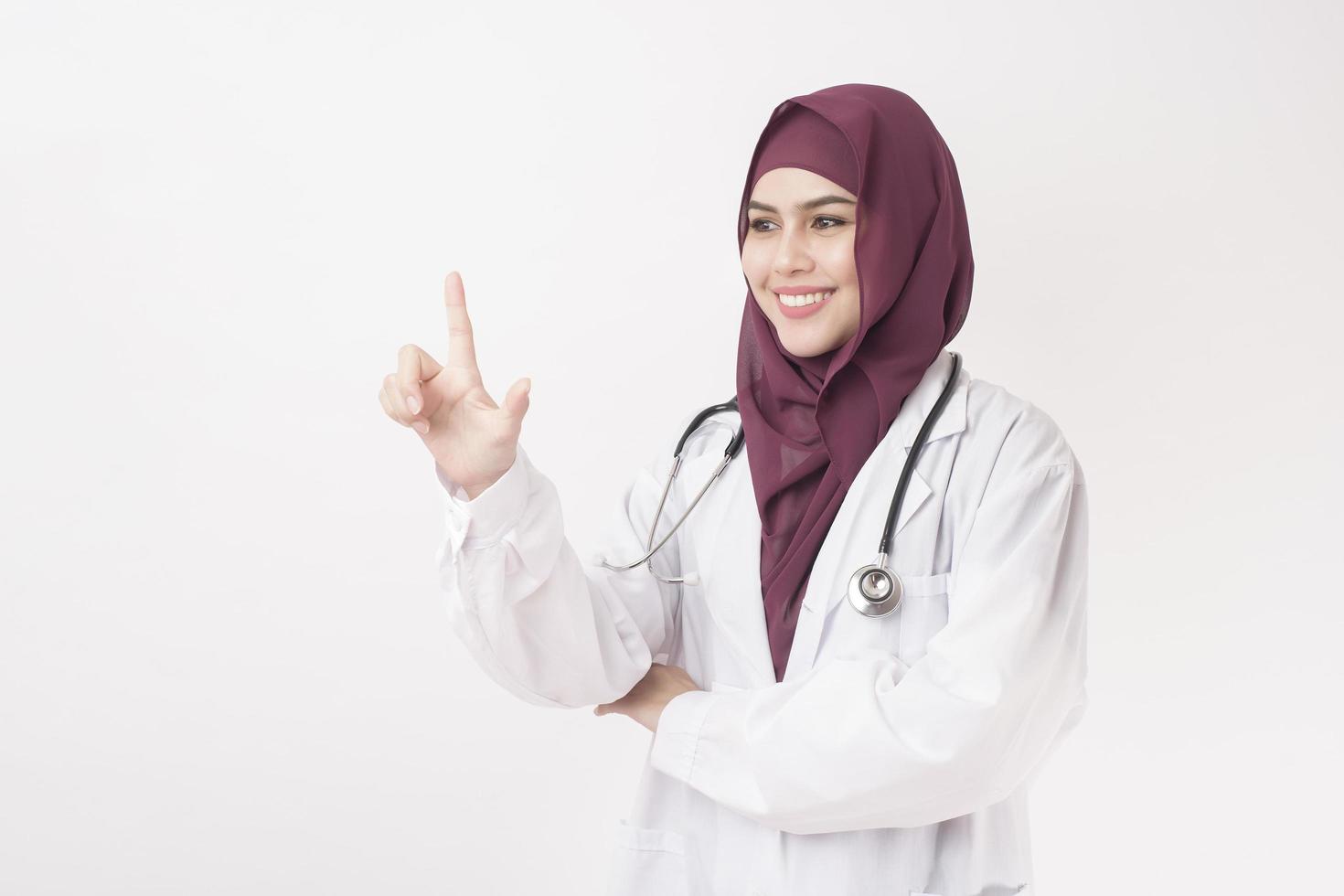 Beautiful woman doctor with hijab portrait on white background photo