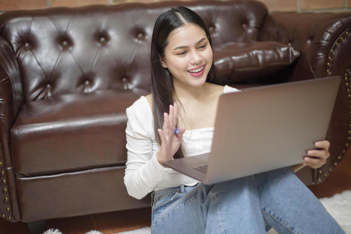 Beautiful woman is working from home photo