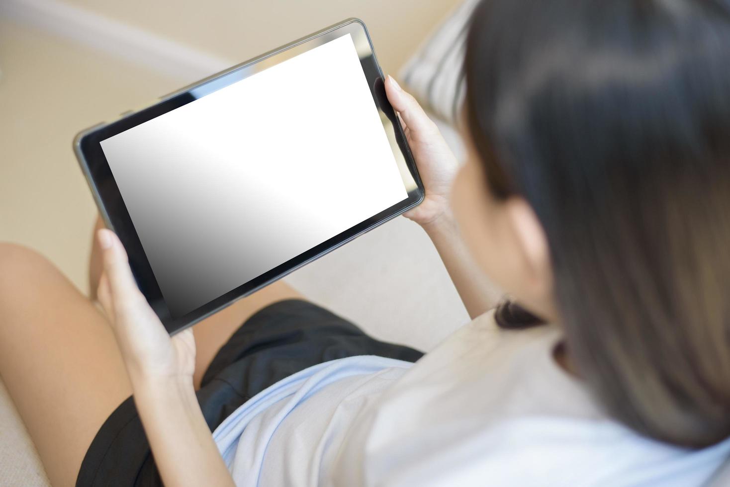 Tablet monitor view mockup over girl shoulders at home photo