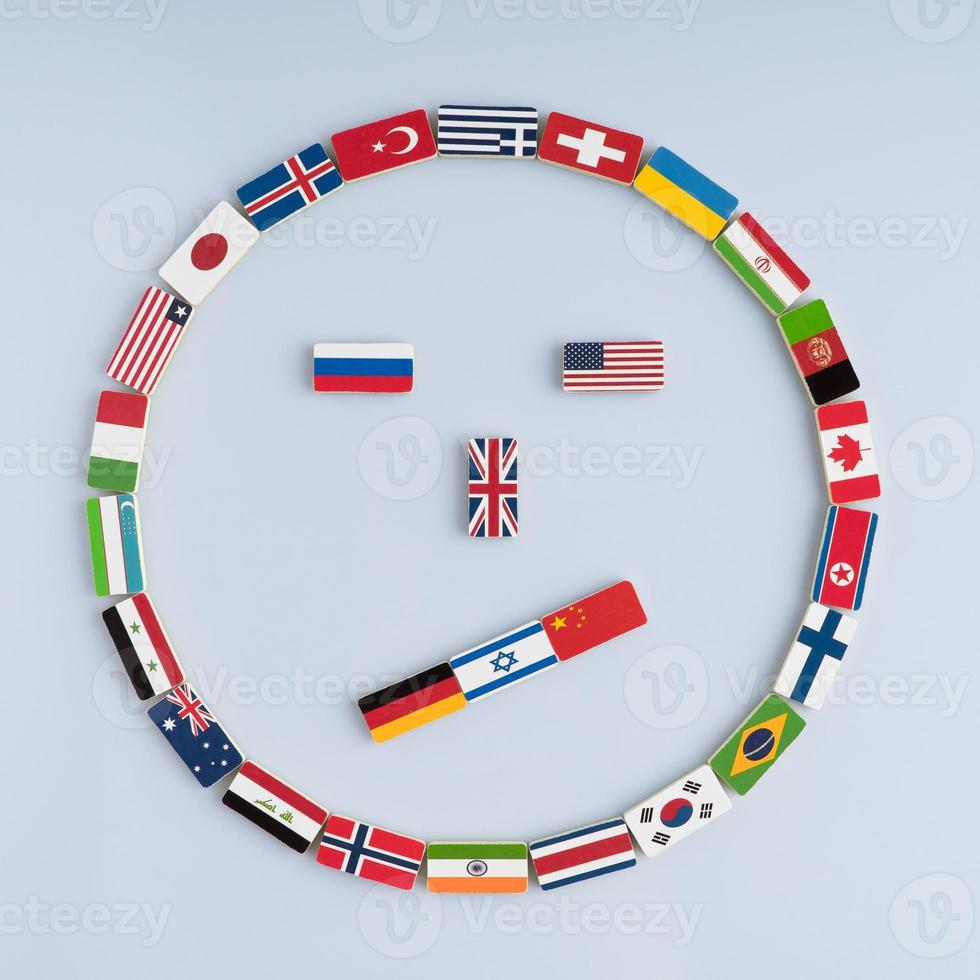 illustration of a smiley face from national flags on dominoes. Concept of peace and the Commonwealth of Nations and the world order photo