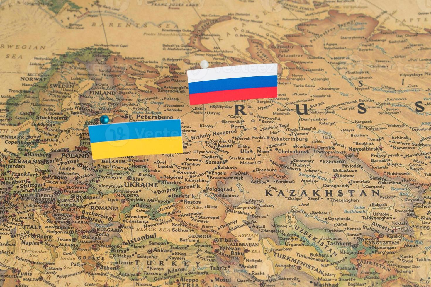 Flags of the Russia and Ukraine on the world map. Conceptual photo, politics and world order, political differences photo