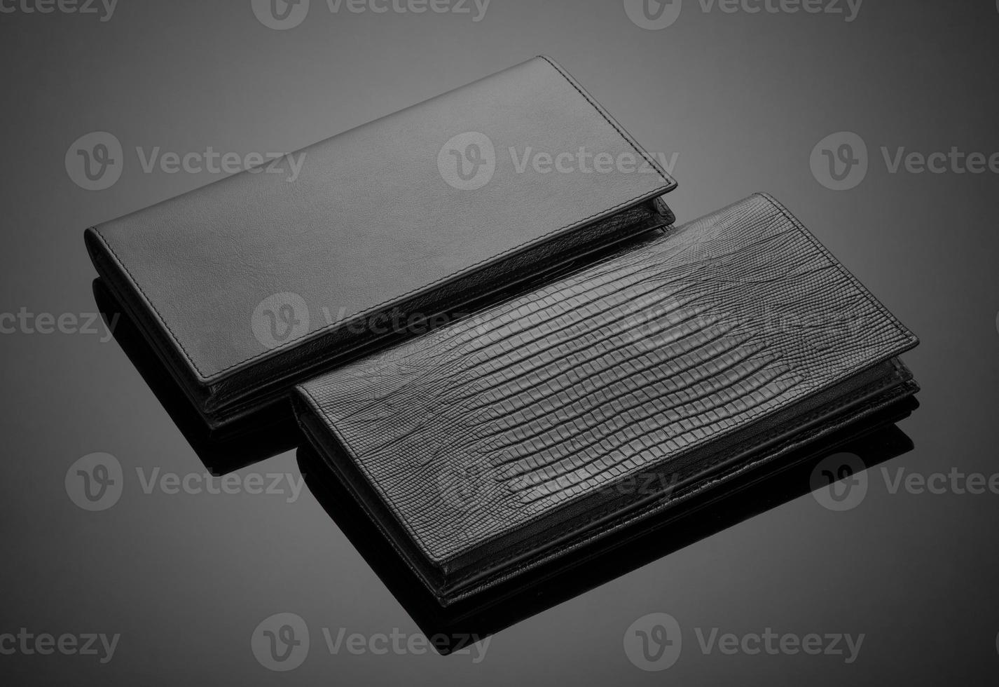 Fashionable leather men's wallet on a dark background photo