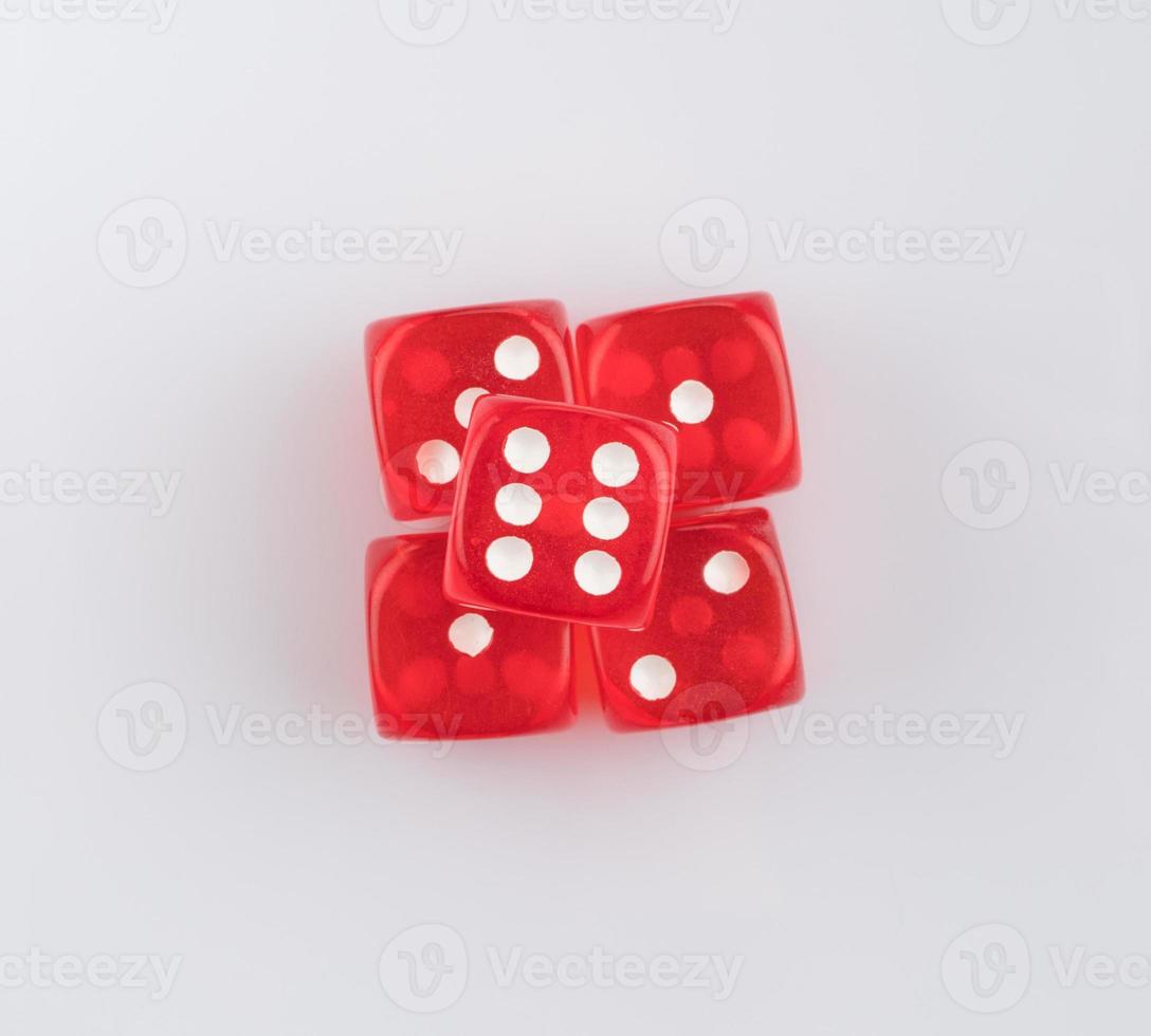 group of red playing dice on a white background, isolated. top view photo