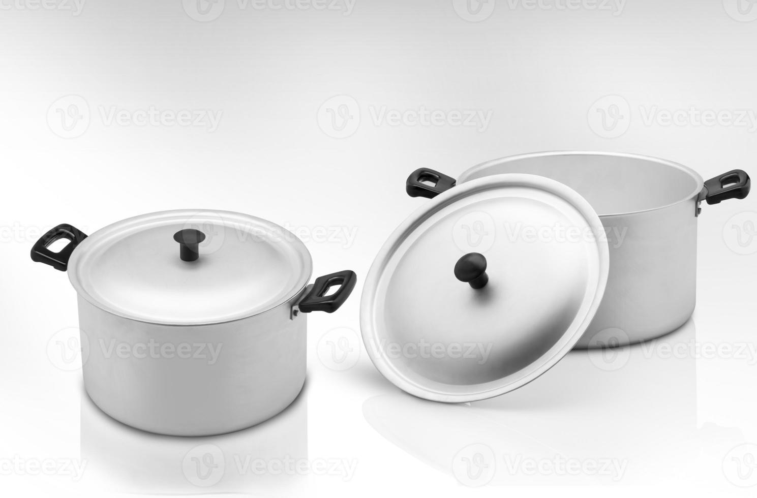several cooking pots on a light background photo
