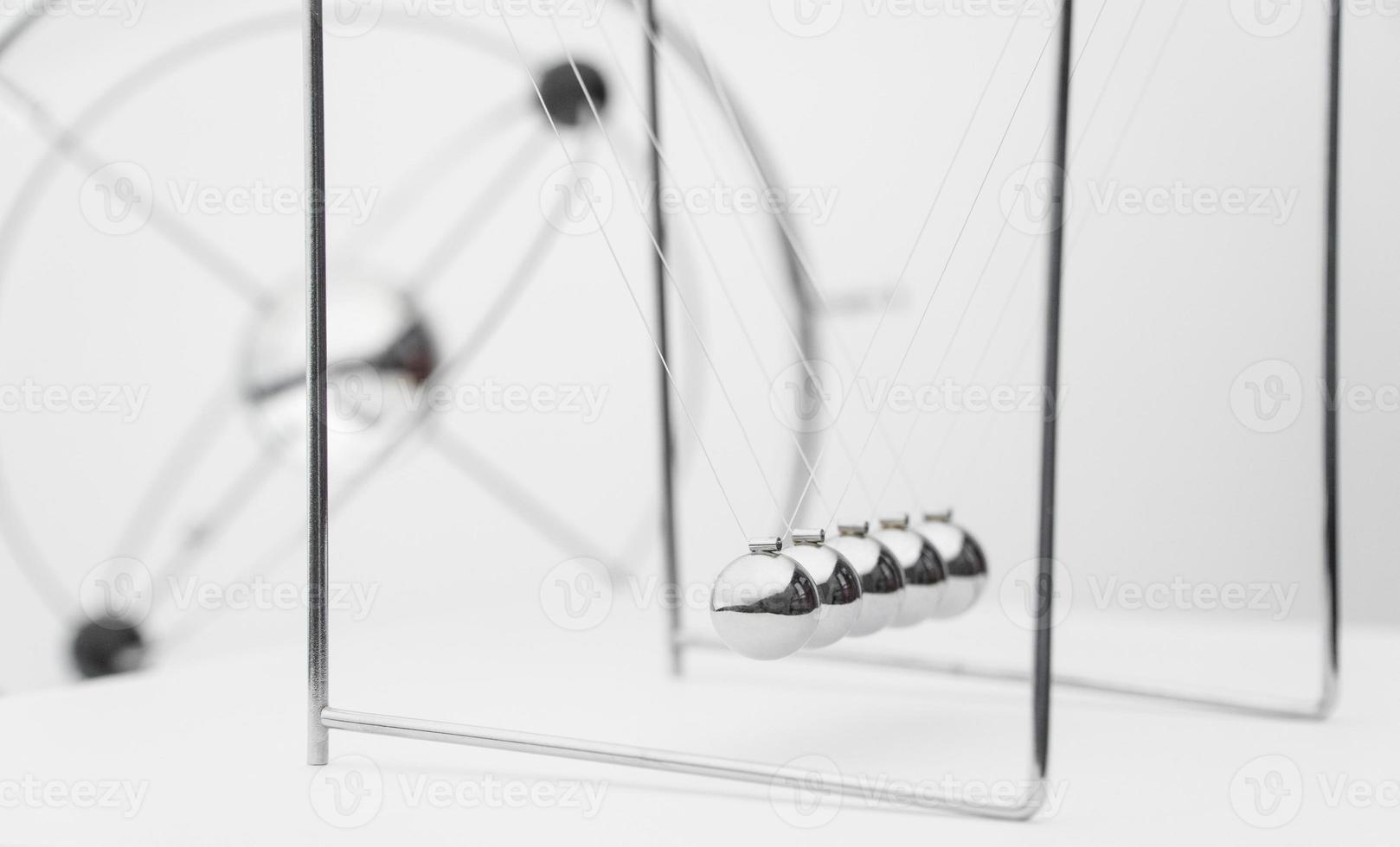 balancing balls on a white background. business concept. Newtons Cradle photo