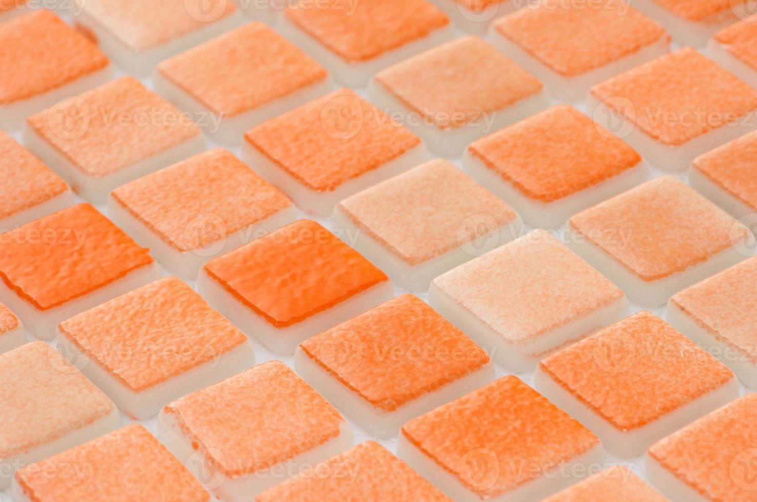 little orange ceramic tile, macro shooting, majolica. for the catalog photo