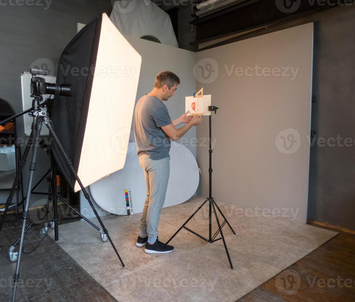 photographer working in the studio to prepare for macro photography. unintended photography photo