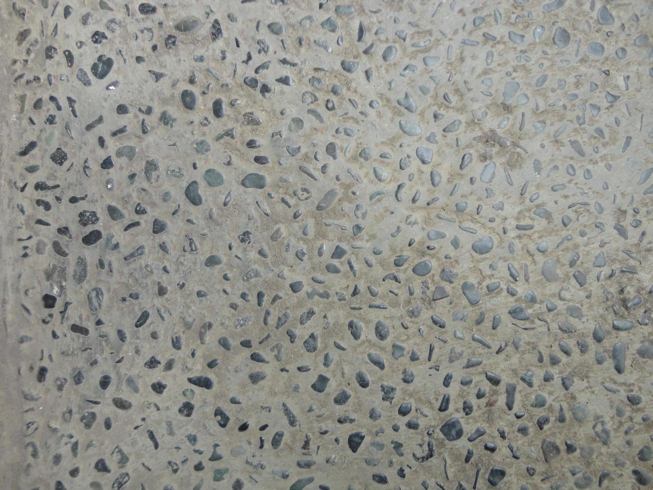 texture of small black rocks in a yard of the house photo