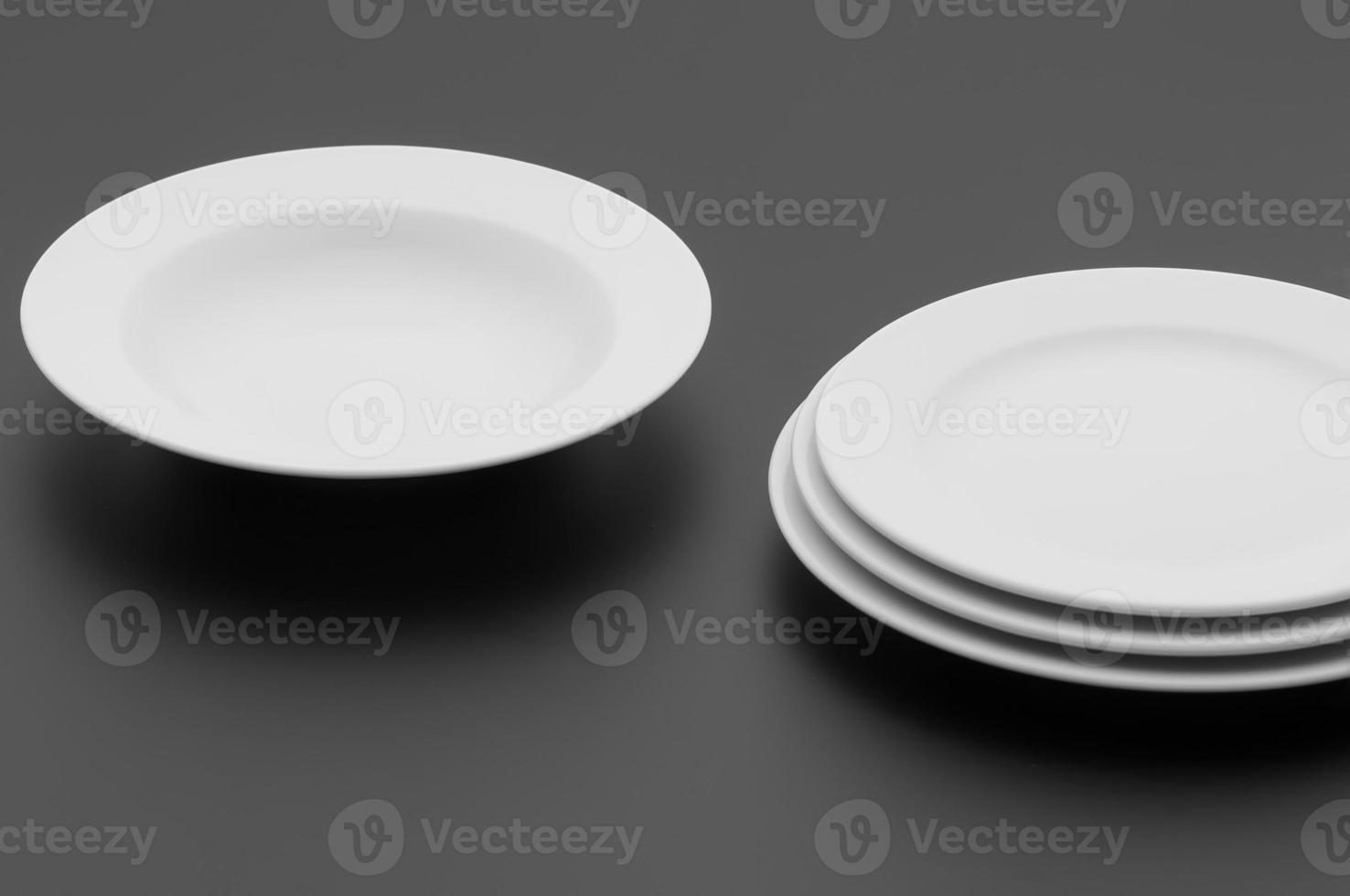 kitchen and restaurant utensils, plates, on a dark background photo