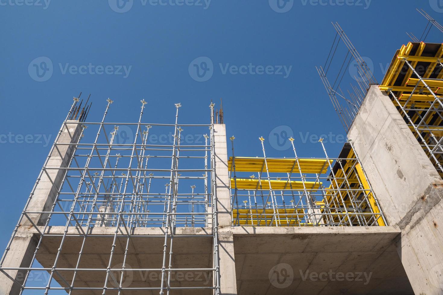 metal concrete structures of the building under construction. scaffolding and supports. bottom view photo