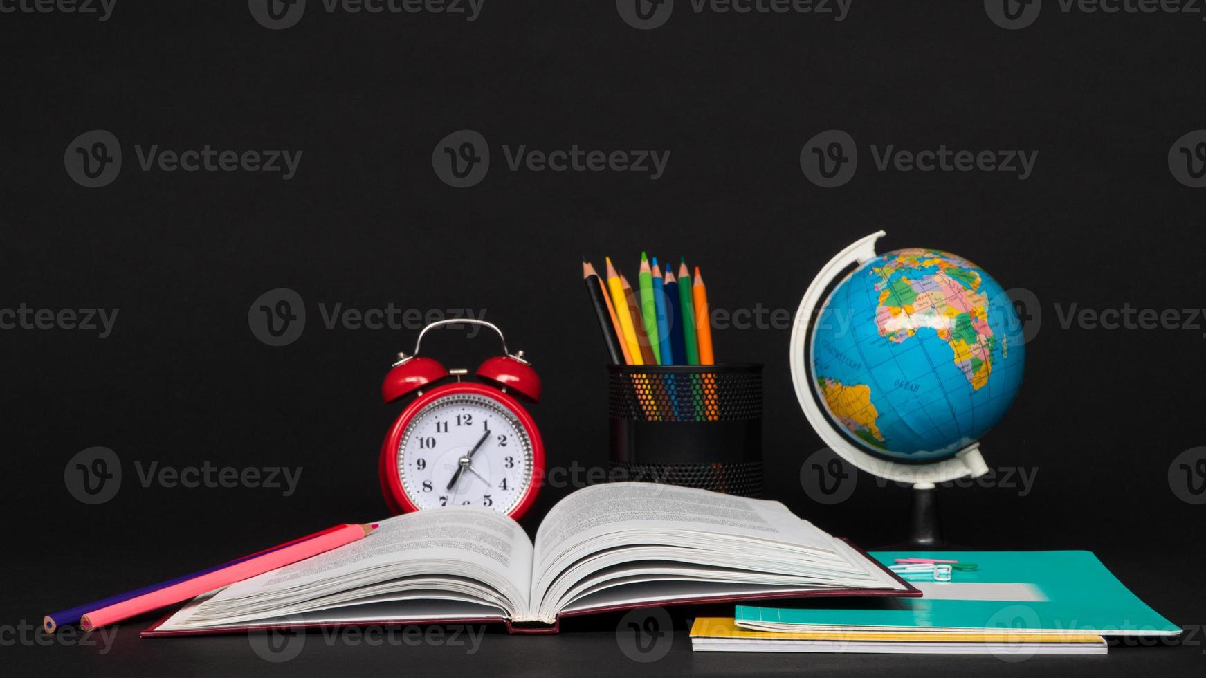 colorful collection of school supplies set on black background. back to school. great ideas photo