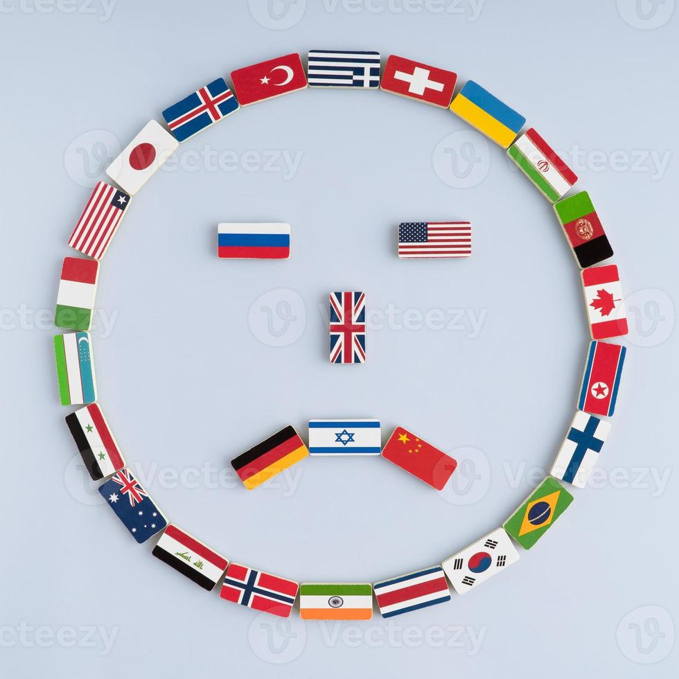 illustration of a smiley face from national flags on dominoes. Concept of peace and the Commonwealth of Nations and the world order photo