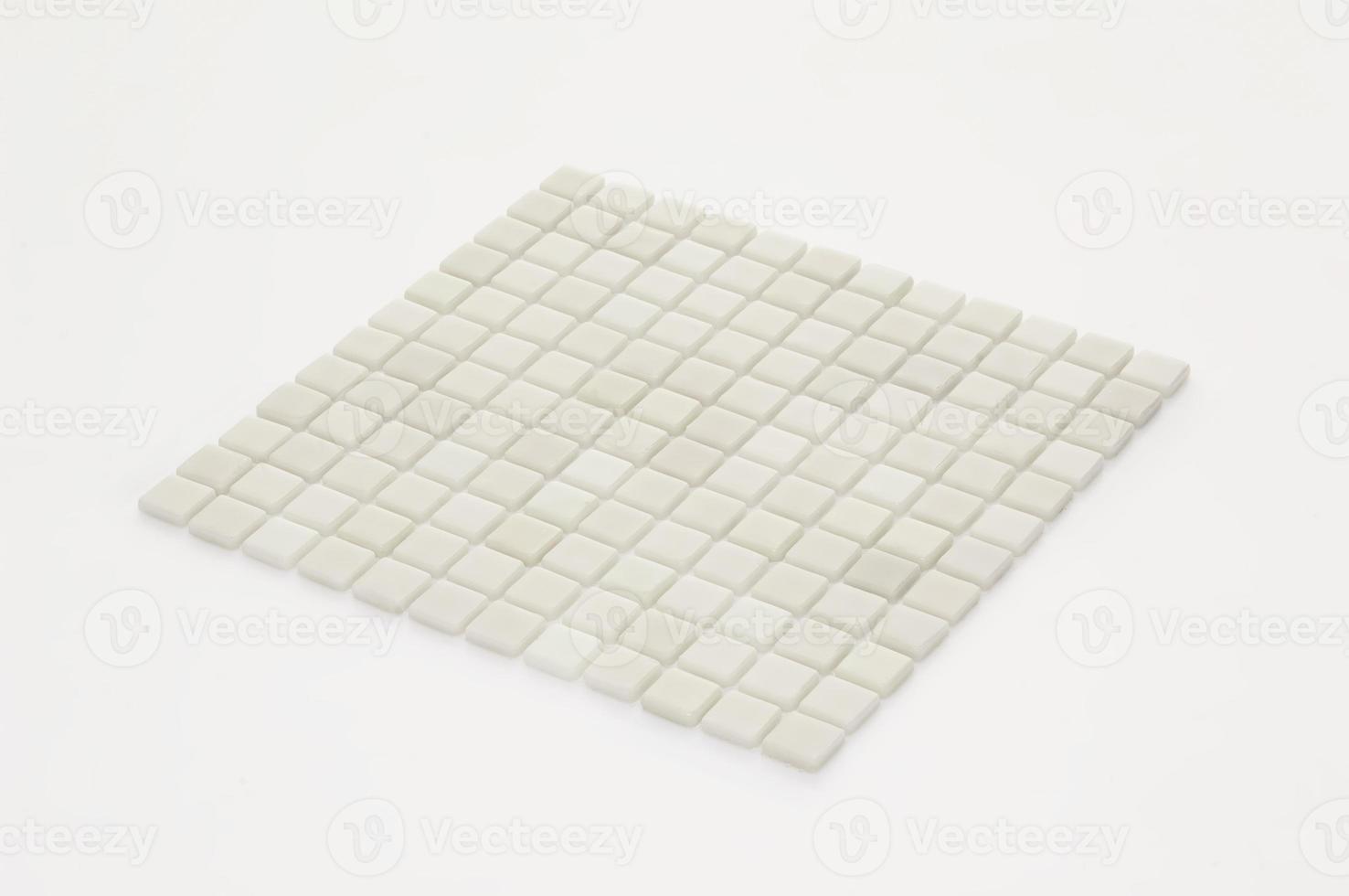 little white ceramic tile on a light background, majolica. for the catalog photo