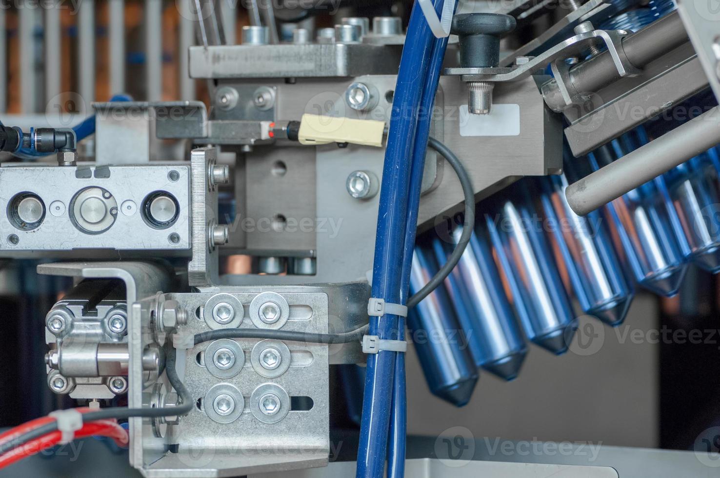 Plant for the production of plastic bottles.  Plastic bottles on a conveyor belt. Bottled water filling photo