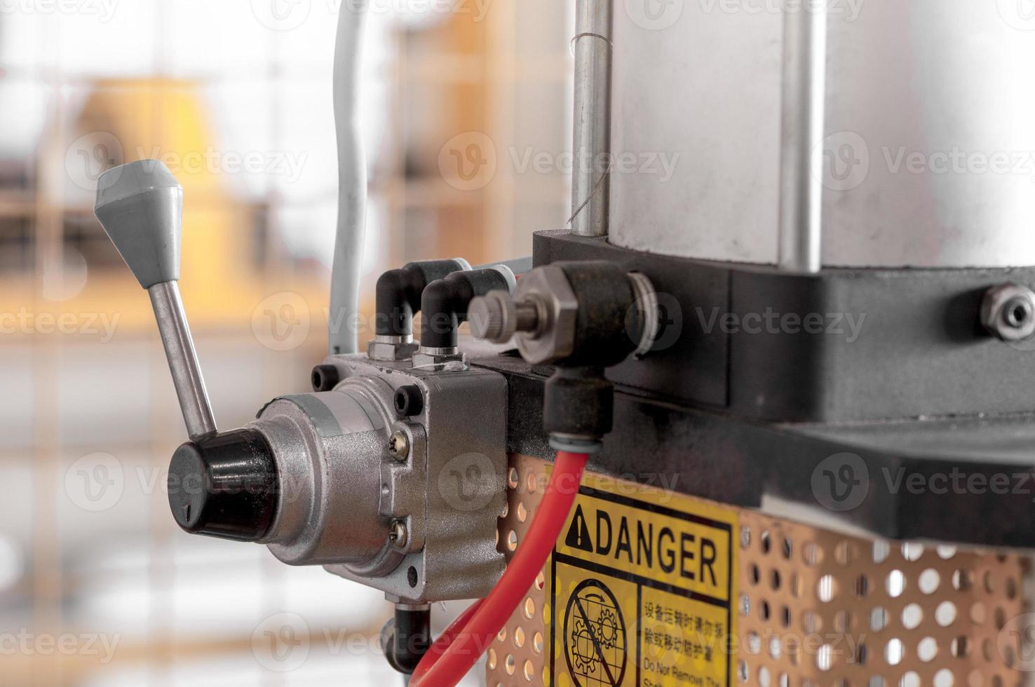 lever to control the machining equipment close up photo