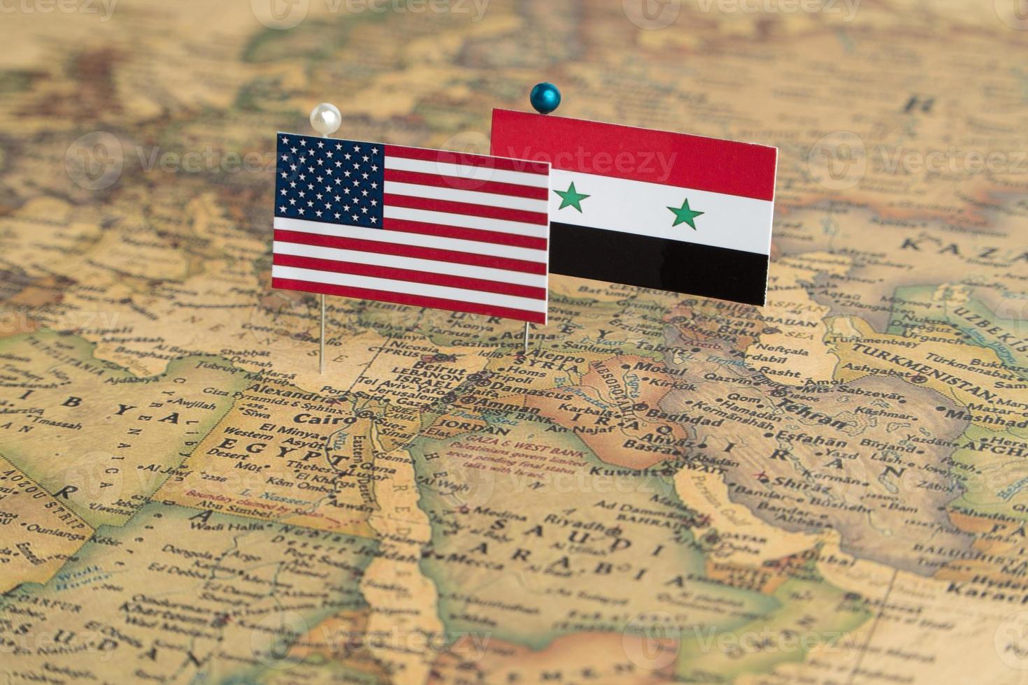 Flags of the USA and Syria on the world map. Conceptual photo, politics and world order, military conflict photo