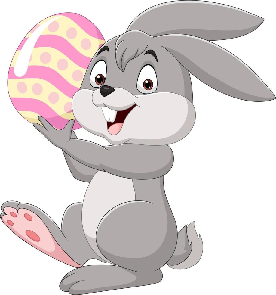 Cartoon little bunny holding Easter egg vector