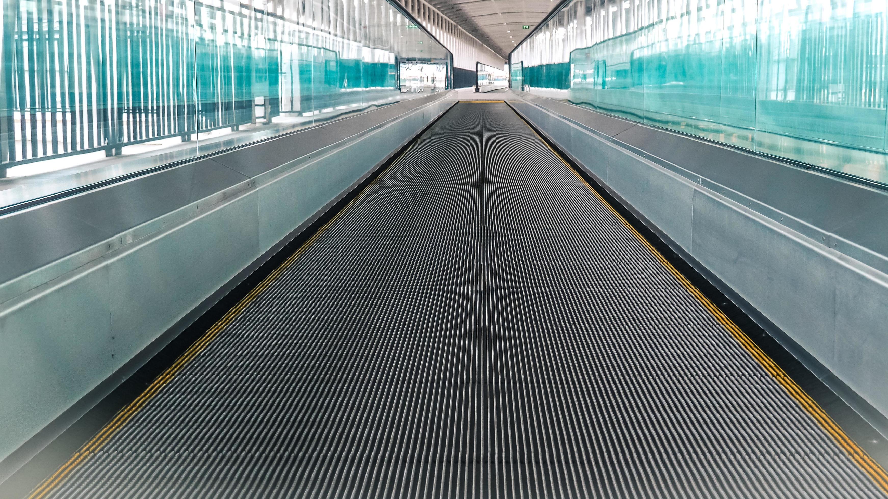 Modern walkway of escalator move forward and escalator move backward in