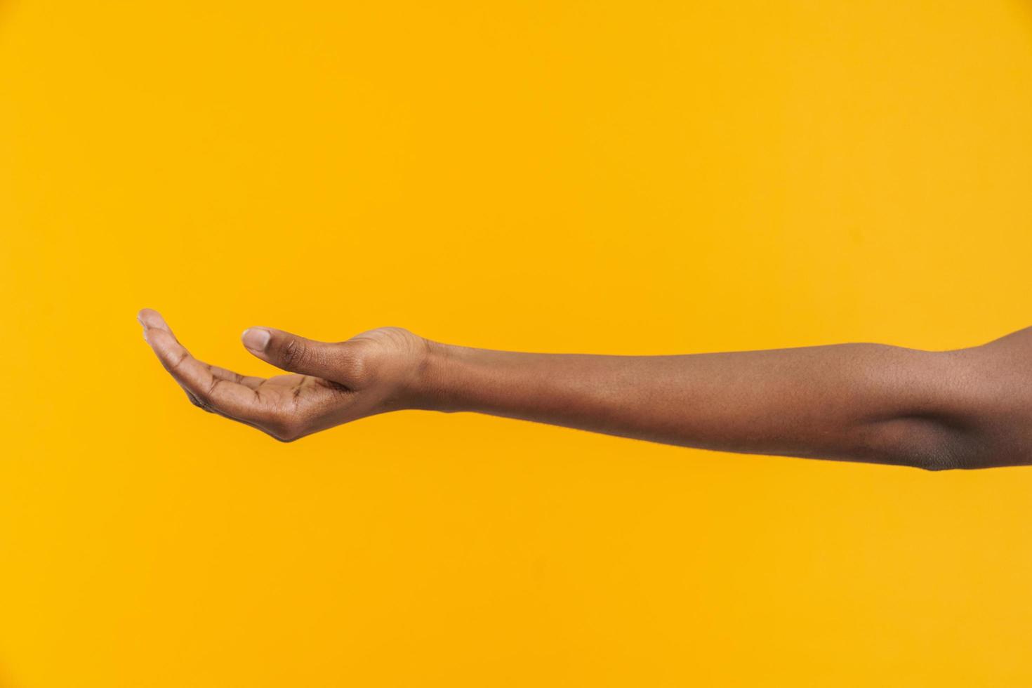 African woman holding palm up to the camera photo