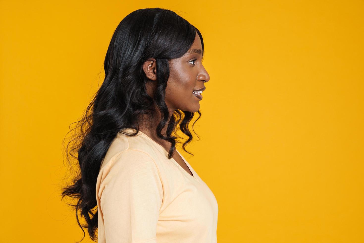 Side view of smiling African woman photo