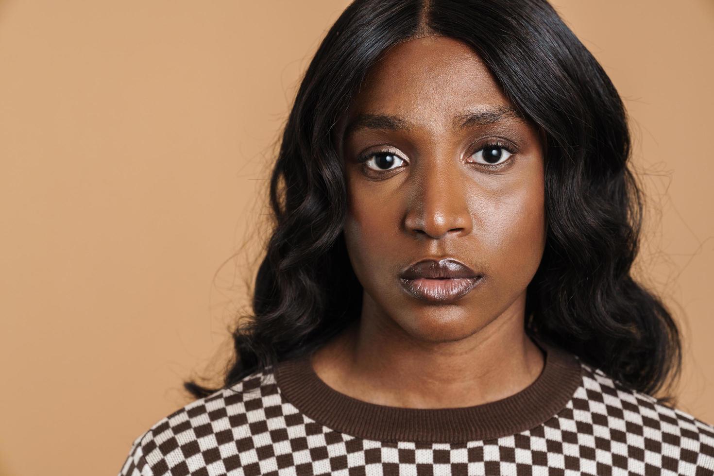 Serious African woman looking at the camera portrait photo