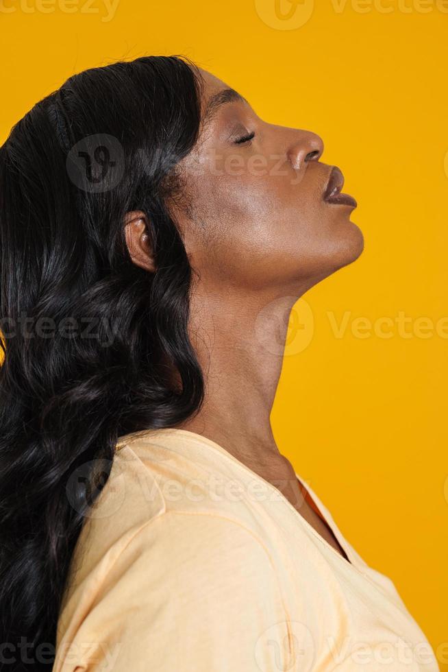 African woman looking up photo