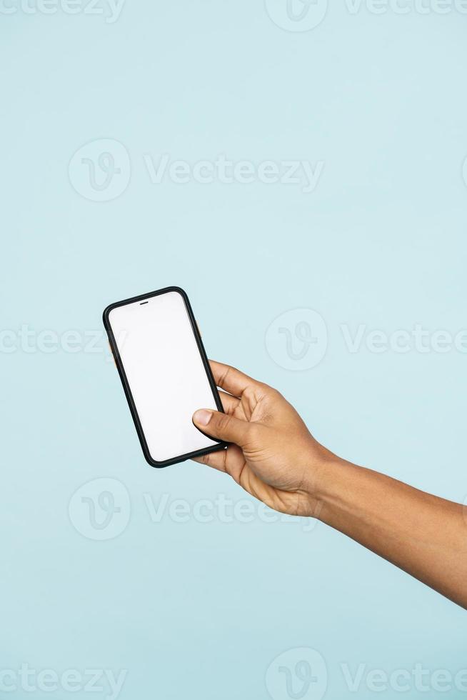 Man holds a phone screen to the camera photo