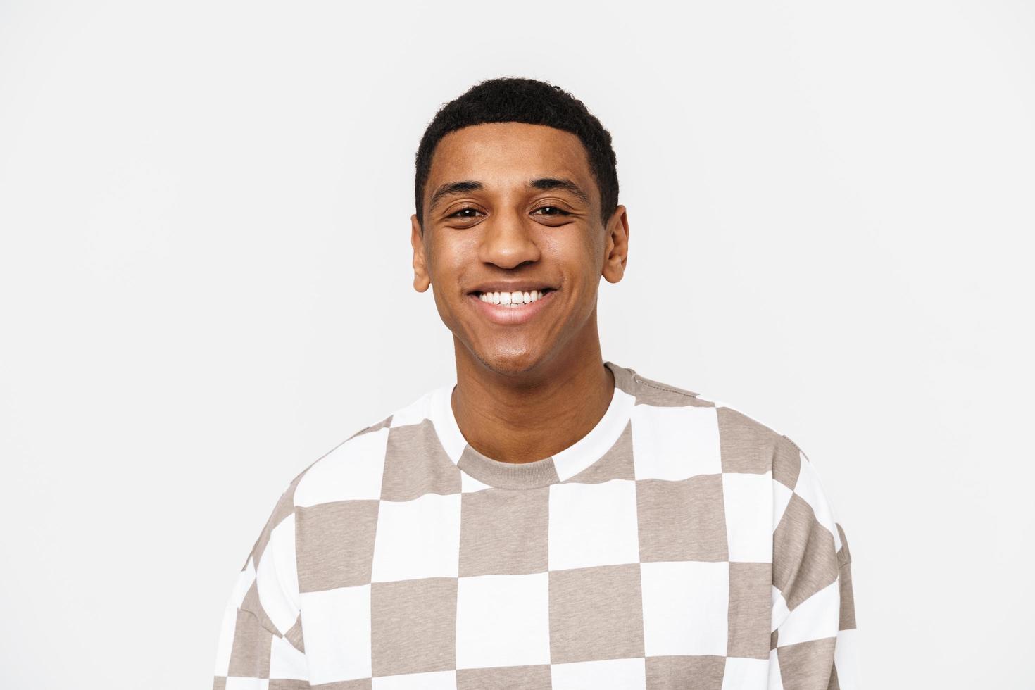 Portrait of cheerful African man smiling and looking at the camera photo