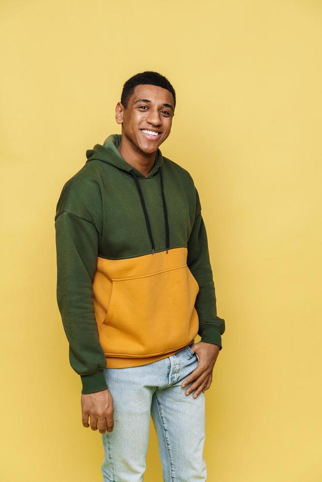 Positive African man in hoodie looking at the camera photo