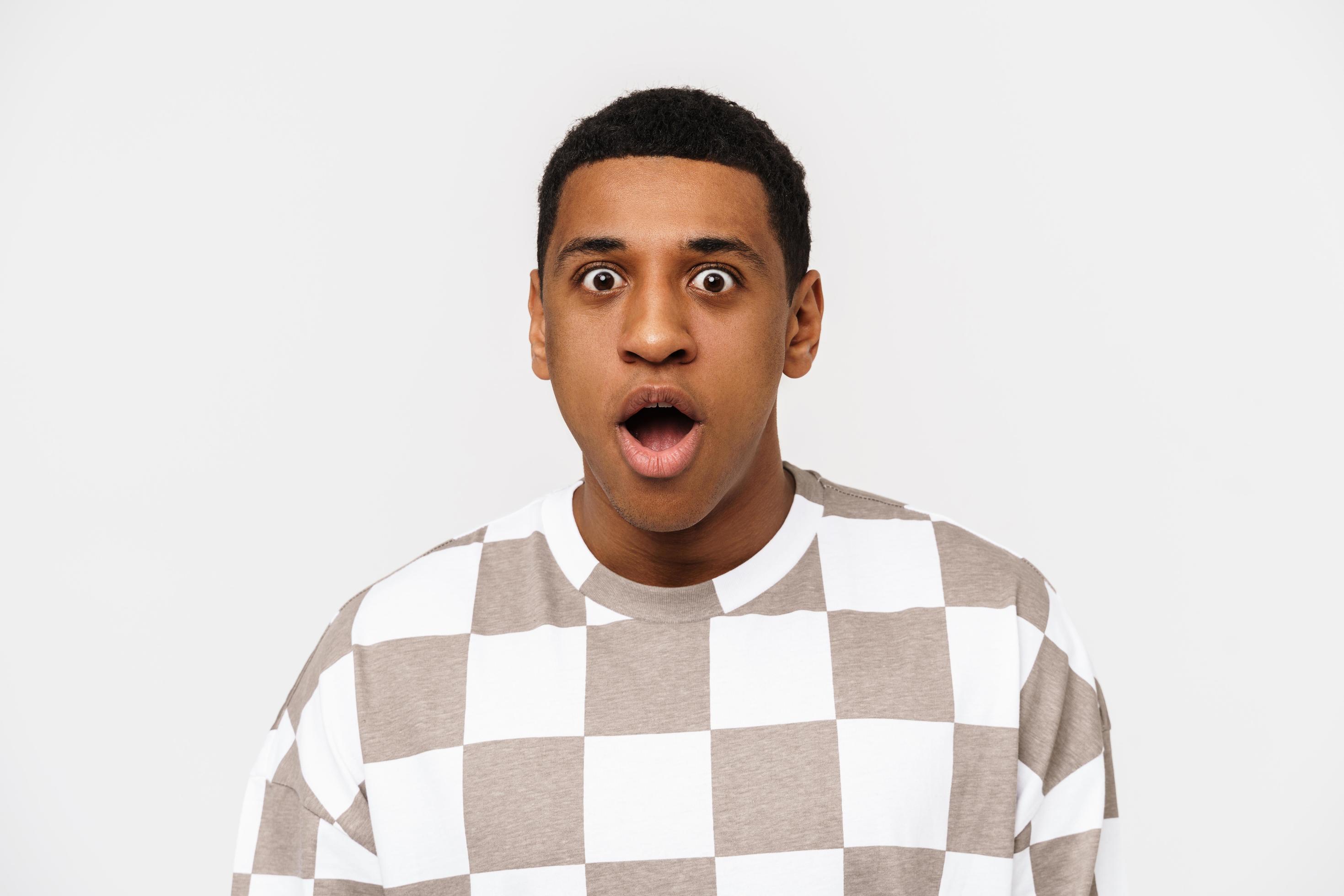 Portrait of surprised Black man looking at the camera photo