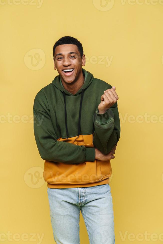 Laughing African man in hoodie looking at the camera photo