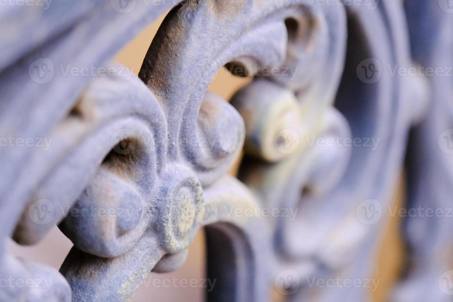 closeup of ancient building facade curved decorative element made of cast iron photo