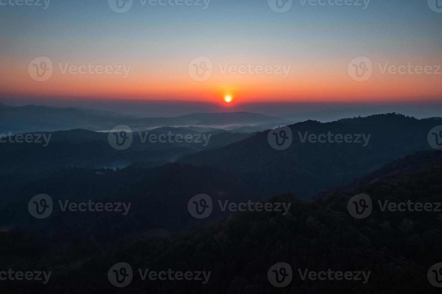 early morning sunrise in the forest photo