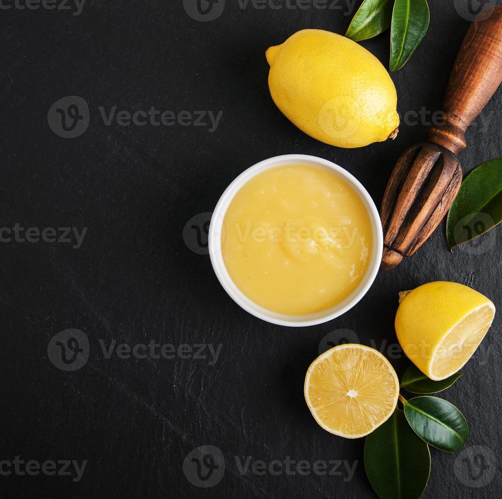 Lemon curd  with fresh lemons photo