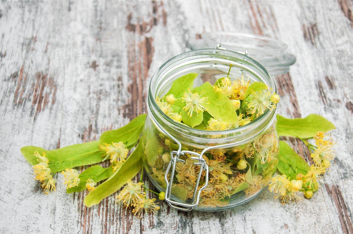 Jar with linden flowers photo
