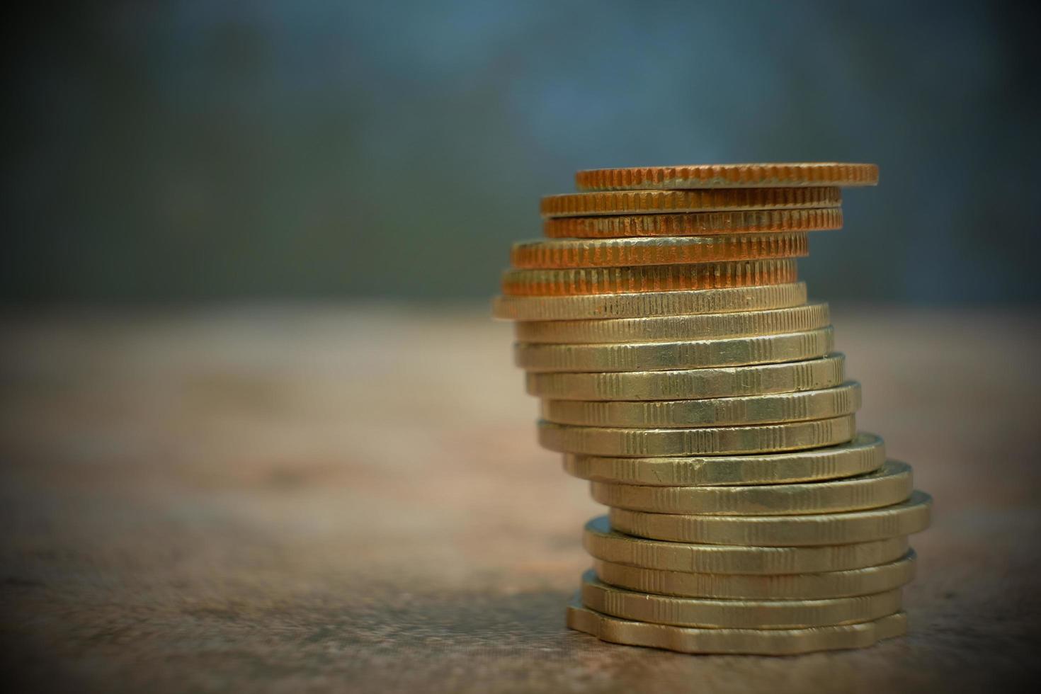 coins on table background and saving money and business growth concept,finance and investment concept, stack of coin on table and saving money photo