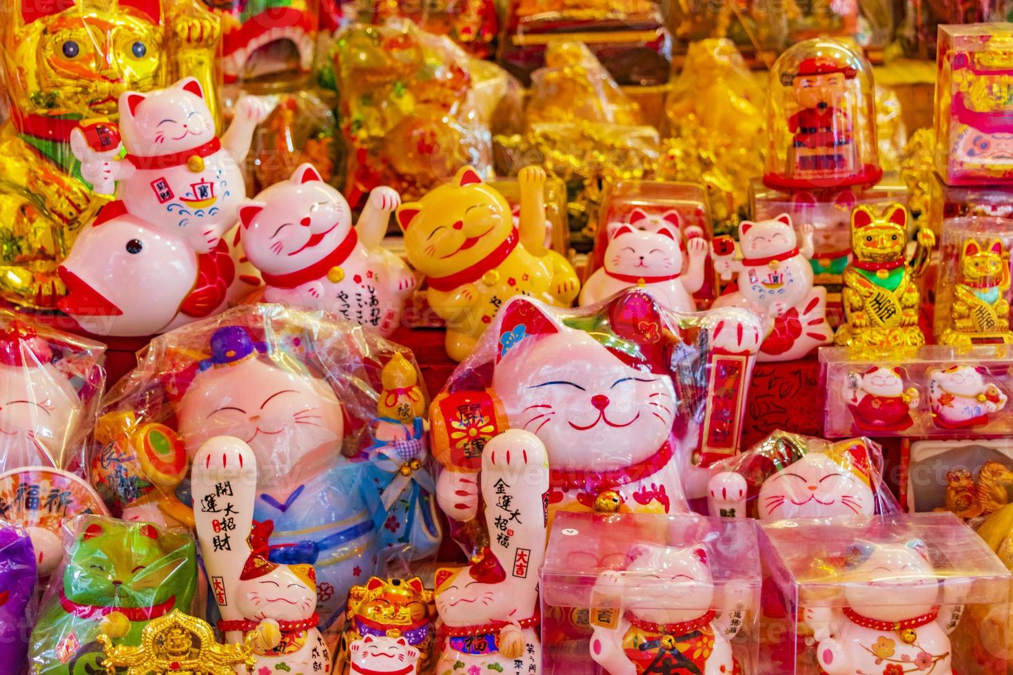 Golden chinese cat Souvenirs in Souvenir shop in Bangkok Thailand. photo