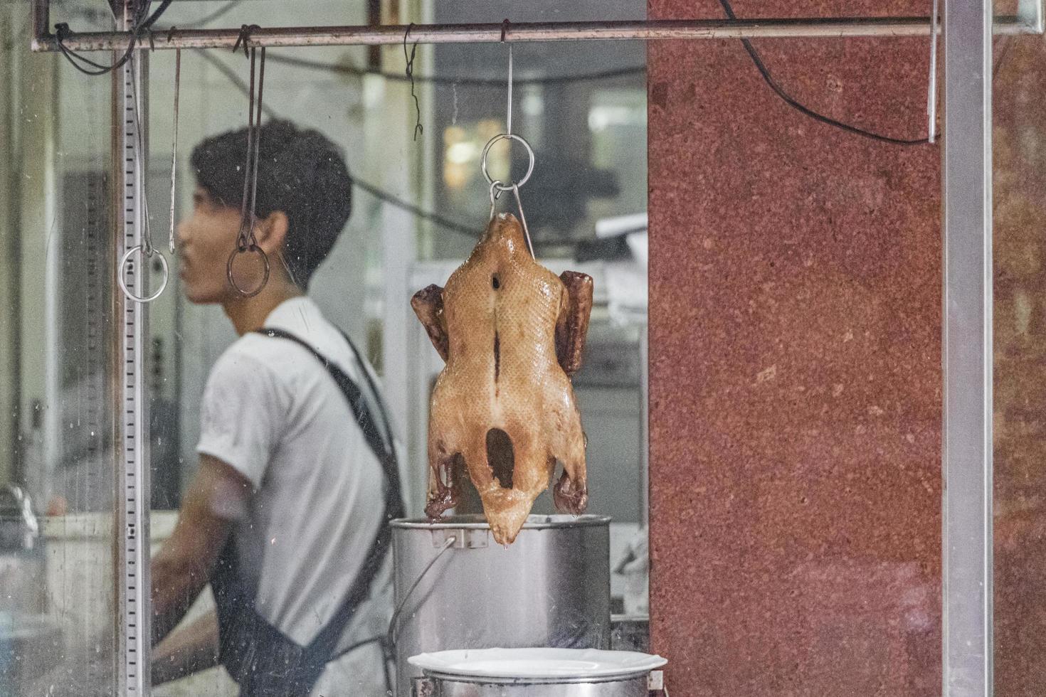 Disgusting Thai Chinese food behind window China Town Bangkok Thailand. photo