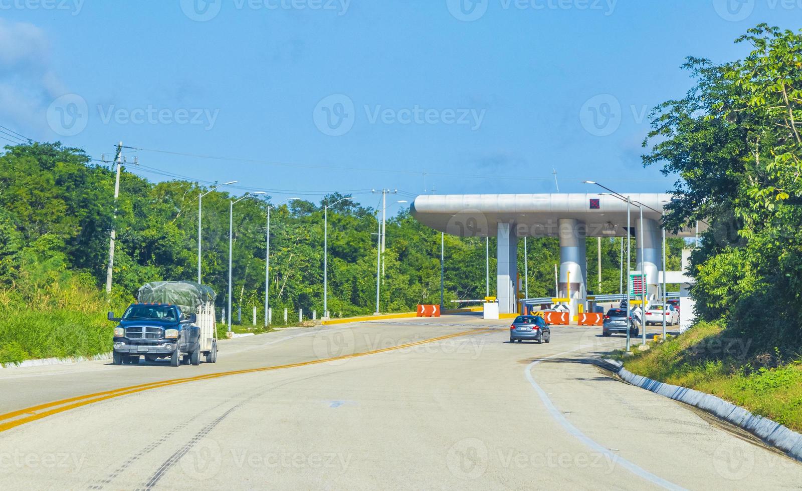 Driving on highway freeway motorway thru toll booth house Mexico. photo