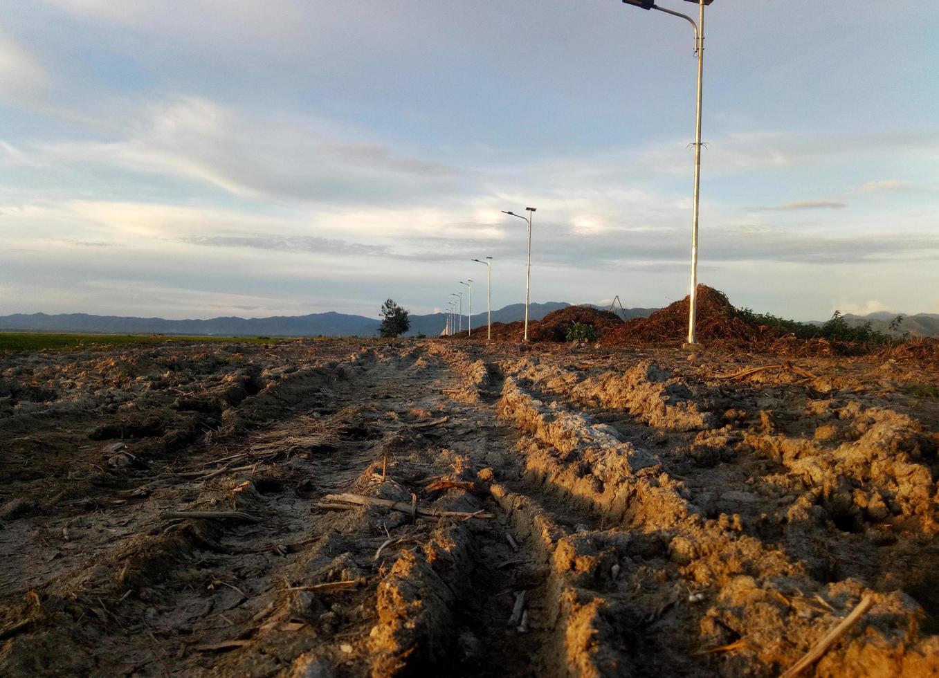 a broken country road. muddy road. photo