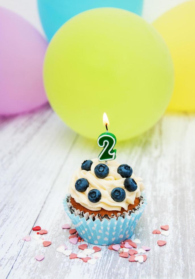 Cupcake with a numeral two candle photo