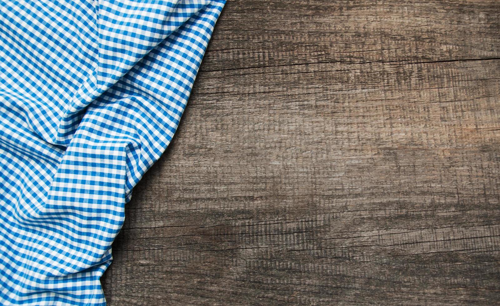 Checkered napkin on a wooden background photo