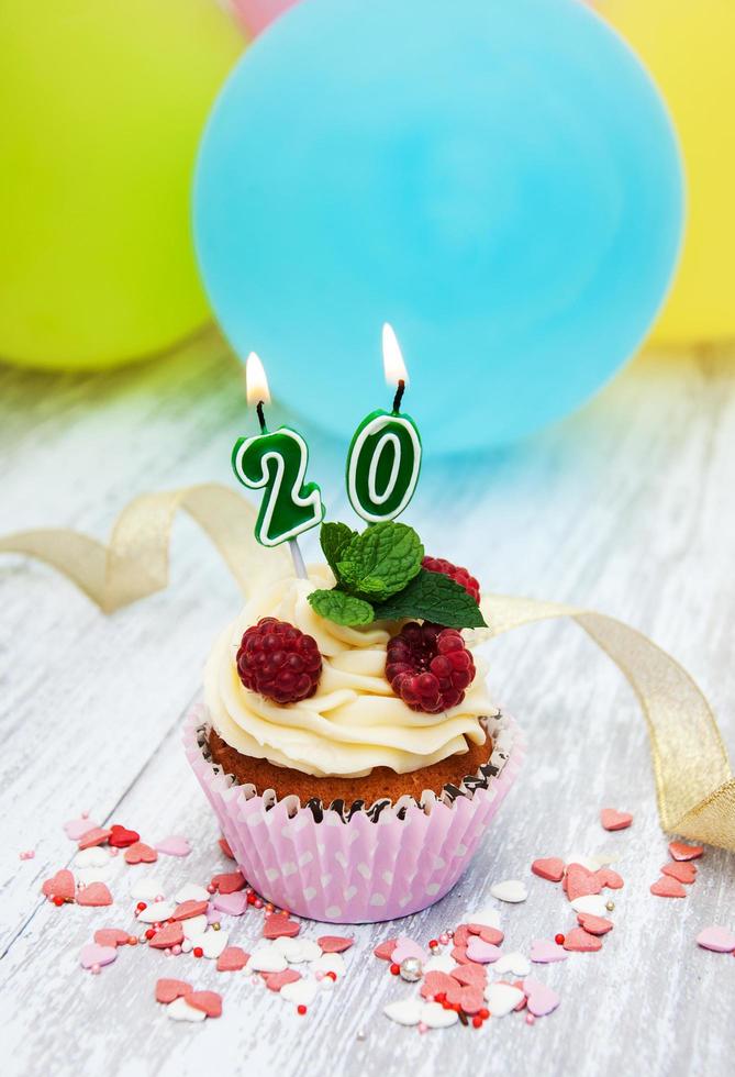 Cupcake with a numeral twenty candle photo