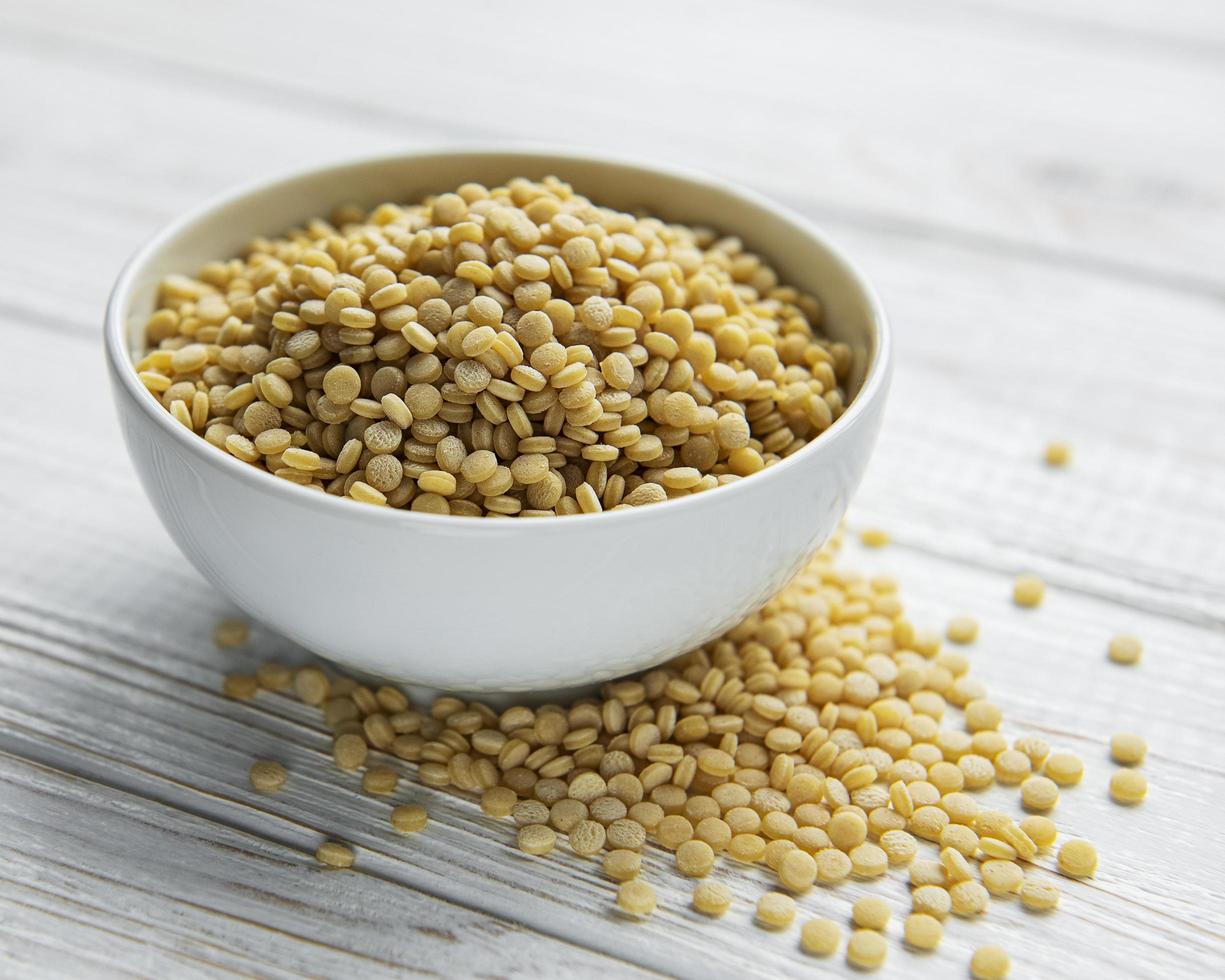 Raw Couscous on a table photo