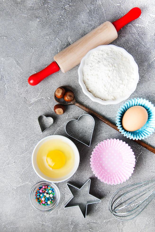 Top view of  kitchen table with baking ingredients photo