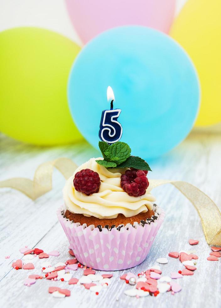 Cupcake with a numeral five candle photo