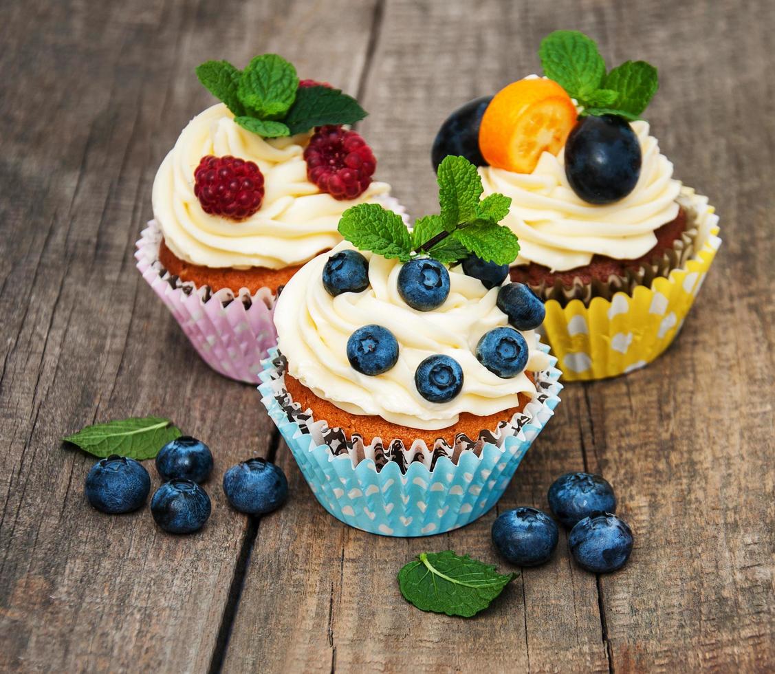 Cupcakes with fresh berries photo